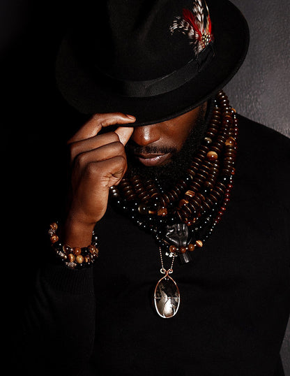 Daniel Jones Adorned in Taji Neckpieces